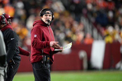 Washington Commanders head coach Dan Quinn watches from the sidelines during the first half of an NFL football game against the Denver Broncos Sunday, Nov. 30, 2025, in Landover, Md. (AP Photo/Nick Wass)