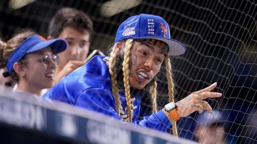 FILE - Rapper Tekashi 6ix9ine watches a baseball game between the Miami Marlins and New York Mets, Aug. 3, 2021, in Miami. (AP Photo/Lynne Sladky, File)