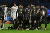 Qarabag's Kevin Medina receives treatment on the pitch during the Champions League opening phase soccer match between Napoli and Qarabag in Naples, Italy, Tuesday Nov. 25, 2025. (Alessandro Garofalo/LaPresse via AP)