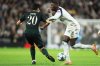 Tottenham's Randal Kolo Muani, right, duels for the ball with Copenhagen's Junnosuke Suzuki during the Champions League opening phase soccer match between Tottenham and Copenhagen, in London, England, Tuesday, Nov. 4, 2025. (AP Photo/Ian Walton)