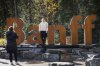 Tourists pose for photos on the icon Banff sign in Banff, Alta., Thursday, Oct. 17, 2024. The town moved the sign to a new location Thursday, Nov. 20. THE CANADIAN PRESS/Jeff McIntosh