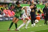 FILE - Bayern Munich's Giulia Gwinn, right, is challenged by VfL Wolfsburg's Cora Zicai, left, during the German women's Bundesliga soccer match between VfL Wolfsburg and FC Bayern Munich in Wolfsburg, Germany, Oct. 11, 2025. (Swen Pfoertner/dpa via AP, File)