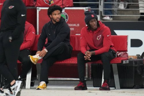 Arizona Cardinals quarterback Kyler Murray, left, and wide receiver Marvin Harrison Jr. sit on the bench during the first half of an NFL football game against the Jacksonville Jaguars Sunday, Nov. 23, 2025, in Glendale, Ariz. (AP Photo/Rick Scuteri)