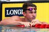 FILE - England's Ben Proud reacts after he was disqualified in his men's 50m butterfly heat during the 2018 Commonwealth Games at the Aquatic Centre on the Gold Coast, Australia, April 5, 2018. (AP Photo/Rick Rycroft, File)