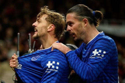 Everton's Kiernan Dewsbury-Hall, left, celebrates with Jack Grealish after scoring the opening goal during the English Premier League soccer match between Manchester United and Everton in Manchester, England, Monday, Nov. 24, 2025. (AP Photo/Dave Thompson)
