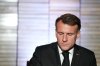 French President Emmanuel Macron signs a register as he attends a commemoration ceremony for French people who fought against apartheid, with South Africa's Deputy President Paul Mashatile and South Africa's Minister of Sports, Arts and Culture Gayton McKenzie at Freedom Park in Pretoria, South Africa, Friday, Nov. 21, 2025. (AP Photo/Thibault Camus)
