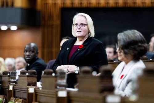 Minister of Veterans Affairs and Associate Minister of National Defence Jill McKnight rises during Question Period in the House of Commons on Parliament Hill in Ottawa, on Friday, Oct. 31, 2025. THE CANADIAN PRESS/Spencer Colby