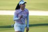 Jeeno Thitikul of Thailand shows her ball after making a birdie putt on the 17th hole during the second round of the LPGA Tour Championship golf tournament, Friday, Nov. 21, 2025, in Naples, Fla. (AP Photo/Marta Lavandier)