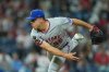FILE - New York Mets pitcher Ryan Helsley throws during the eighth inning of a baseball game Sept. 10, 2025, in Philadelphia. (AP Photo/Matt Rourke, File)