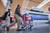 Travellers rush towards the Air Canada departure gates  at Pearson International Airport in Toronto, Saturday, Aug. 16, 2025. THE CANADIAN PRESS/Sammy Kogan