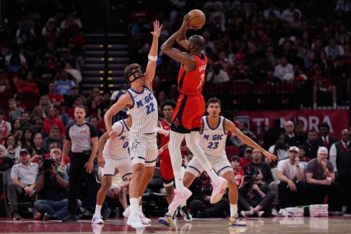 Houston Rockets forward Kevin Durant (7) shoots against Orlando Magic forward Franz Wagner (22) and forward Tristan da Silva (23) during the first half of an NBA basketball game in Houston, Sunday, Nov. 16, 2025. (AP Photo/Ashley Landis)