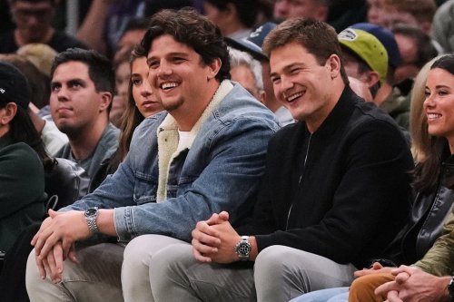 FILE - New England Patriots quarterback Drake Maye, right, sits with teammate Will Campbell during first half of an NBA basketball game between the Boston Celtics and Utah Jazz, Monday, Nov. 3, 2025, in Boston. (AP Photo/Charles Krupa, File)