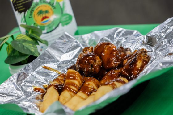 The Tropical Thunder House of Jerk serves up Jamaican/Italian fare in the West St. Paul Curling Club Tuesday, (John Woods / Free Press)