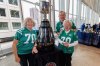 MIKE DEAL / FREE PRESS Former Saskatchewan Roughriders (1973-1980) wide receiver, Steve Mazurak, with his wife Heather (left) and his 96-year-old mother-in-law, Brenda Thomson, and the Grey Cup during the CFLAA Legends Luncheon being held at the RBC Convention Centre on Friday. Standup 251114 - Friday, November 14, 2025.