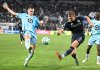San Diego FC defender Jeppe Tverskov (6) shoots past Minnesota United midfielder Robin Lod (17) during the first half of MLS soccer's Western Conference semifinal Monday, Nov. 24, 2025, in San Diego. (AP Photo/Denis Poroy)