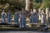 Actor Mary Mina playing the role of high priestess, center, performs during a rehearsal ahead of the flame lighting for the Milan Cortina 2026 Winter Olympics, at the Ancient Olympia site, Greece, Monday, Nov. 24, 2025. (AP Photo/Thanassis Stavrakis)