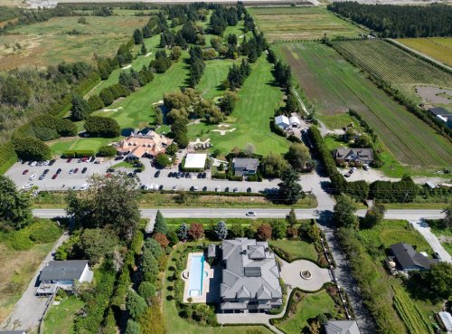 Houses and farmland along No. 6 Road and Country Meadows Golf Course, which fall within the boundaries of a Cowichan Nation Aboriginal title claim, are seen in an aerial view in Richmond, B.C., on Friday, Aug. 22, 2025. A ruling in B.C. Supreme Court confirmed Cowichan Aboriginal title and fishing rights over a stretch of land on Lulu Island next to the south arm of the Fraser River where the nation had a summer village where members fished for salmon. According to the Cowichan Nation the village was first observed by Hudson's Bay Company officials in 1824 as containing over 108 long houses. THE CANADIAN PRESS/Darryl Dyck