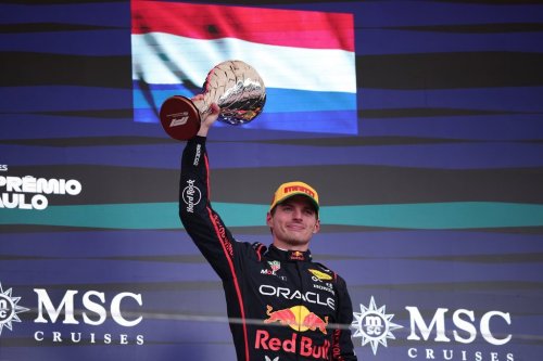 Red Bull driver Max Verstappen of the Netherlands celebrates on the podium his third place during the Brazilian Formula One Grand Prix at the Interlagos race track, in Sao Paulo, Sunday, Nov. 9, 2025. (AP Photo/Ettore Chiereguini)