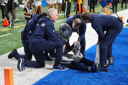 Dallas Cowboys wide receiver Ceedee Lamb is tended to by trainers during the second half of an NFL football game against the Detroit Lions Thursday, Dec. 4, 2025, in Detroit. (AP Photo/Paul Sancya)