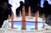 Pepole look at a Diorama of Birmingham City Football Club's new stadium plans during the unveiling in Birmingham, England, Thursday, Nov. 20, 2025. (Jacob King/PA via AP)
