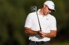 Rory McIlroy. of Northern Ireland, reacts after putting on the the 11th hole during the first round of the Australian Open golf tournament in Melbourne, Australia, Thursday, Dec. 4, 2025. (AP Photo/Asanka Brendon Ratnayake)