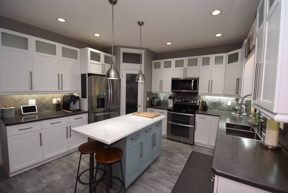 Todd Lewys / Free Press
Remodelled in 2022, the kitchen features a mid-sized quartz island, a host of white cabinets, grey diamond-tile backsplash and newer stainless-steel appliances.