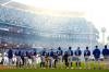 The Toronto Blue Jays and Los Angeles Dodgers listen to the singing of the national anthems ahead of first inning Game 3 World Series playoff MLB baseball action in Los Angeles on Monday, Oct. 27, 2025. (Frank Gunn / The Canadian Press files)