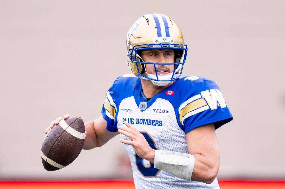 CHRISTOPHER KATSAROV / THE CANADIAN PRESS
Winnipeg Blue Bombers quarterback Zach Collaros (8) looks to throw the ball during first half Eastern semi-final action against the Montreal Alouettes, in Montreal on Saturday, Nov. 1, 2025.