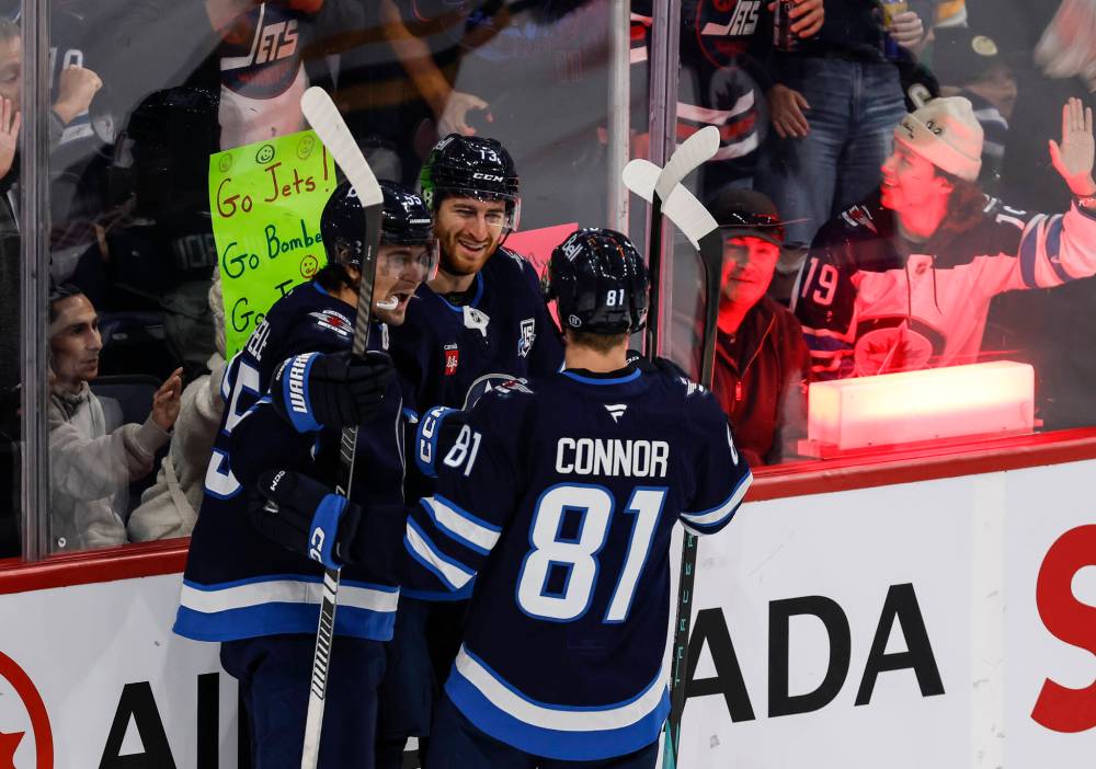 Winnipeg Jets' Mark Scheifele (55), Gabriel Vilardi (13) and Kyle Connor (81) celebrate Vilardi’s goal against the Pittsburgh Penguins during first period NHL action in Winnipeg, Saturday, Nov. 1, 2025. THE CANADIAN PRESS/John Woods
