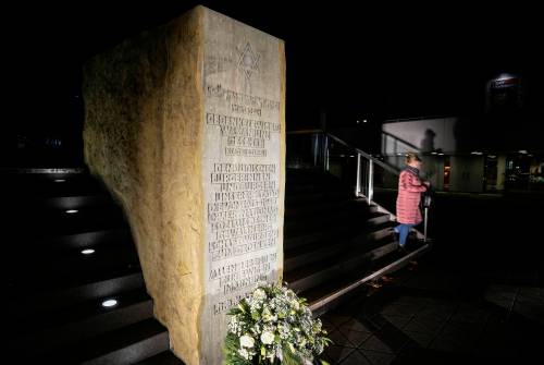 Martin Meissner / The Associated Press files
                                A woman passes a memorial stone where a synagogue once stood before it was destroyed by the Nazis in 1938 in Dortmund, Germany.
