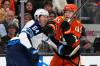 Winnipeg Jets defenseman Logan Stanley, left, is hit in the face by Anaheim Ducks right wing Beckett Sennecke during the first period of an NHL hockey game, Sunday, Nov. 9, 2025, in Anaheim, Calif. (Mark J. Terrill / The Associated Press)
