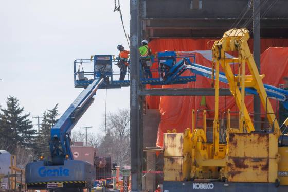 Construction workers at the north end sewage plant in March. The city says completing Phase 3 of the project would result in Winnipeg’s economy growing faster. (Mike Deal / Free Press files)