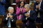Adrian Wyld / The Canadian Press
                                Prime Minister Mark Carney and Finance Minister Francois-Philippe Champagne applaud following a vote on the federal budget on Parliament Hill in Ottawa on Monday.