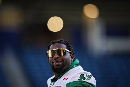 Saskatchewan Roughriders offensive lineman Jermarcus Hardrick smiles during a walkthrough ahead of the 112th CFL Grey Cup, in Winnipeg, on Saturday, November 15, 2025. (Darryl Dyck / The Canadian Press)