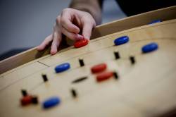 JOHN WOODS / FREE PRESS
                                Crokinole players meet regularly to test their skills against competition other than family and friends.