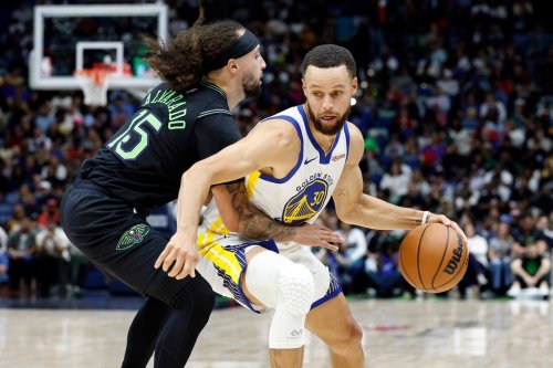 Golden State Warriors guard Stephen Curry (30) dribbles around New Orleans Pelicans guard Jose Alvarado (15) during the second quarter of an NBA basketball game, Sunday, Nov. 16, 2025, in New Orleans. (AP Photo/Butch Dill)