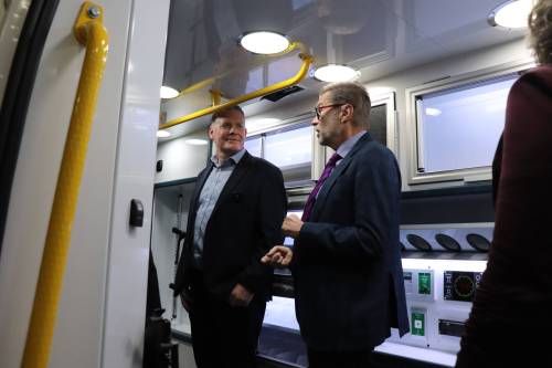 MoveMobility founder Richard Jones (left) chats with Winnipeg West MP Dr. Doug Eyolfson inside one of the company’s custom ambulance vans on Friday following a $1.1 million federal investment. (Tyler Searle / Free Press)