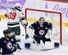 FRED GREENSLADE / THE CANADIAN PRESS
                                Winnipeg Jets’ goaltender Eric Comrie (1) makes a save on a Minnesota Wild shot as Ben Jones (39) looks for the rebound during the third period of Sunday’s game.