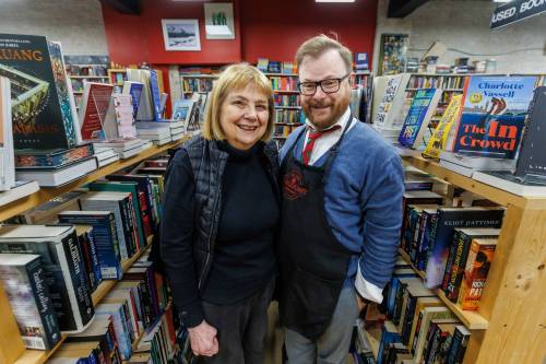 MIKE DEAL / FREE PRESS
                                Wendy Bumsted and son Michael Bumsted, at Whodunit Mystery Bookstore on Lilac Street, have had more difficulty with delays in shipping than the tariffs themselves.