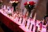 MIKAELA MACKENZIE / FREE PRESS
                                A long table near the edge of the hall holds photos of some of Manitoba&rsquo;s missing and murdered Indigenous women, girls and two-spirit people stood surrounded by flowers and candles at the Red Dress Alert report release event on Tuesday.