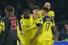Tottenham's Randal Kolo Muani, left, celebrates with his teammates after scoring his side's second goal during a Champions League opening phase soccer match between Paris Saint Germain and Tottenham, in Paris, Wednesday, Nov.26, 2025. (AP Photo/Christophe Ena)