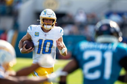 Los Angeles Chargers quarterback Justin Herbert (10) runs during the first half of an NFL football game against the Jacksonville Jaguarse, Sunday, Nov. 16, 2025, in Jacksonville, Fla. (AP Photo/John Raoux)