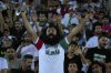 An Iranian fan celebrates after Iran defeated North Korea during their Asian qualifier group A soccer match for 2026 World Cup, at Azadi Stadium in Tehran, Iran, Tuesday, June 10, 2025. THE CANADIAN PRESS/AP-Vahid Salemi