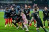 Bayern players celebrate after winning the German soccer cup round of sixteen match between 1. FC Union Berlin and FC Bayern Munich in Berlin, Germany, Wednesday, Dec. 3, 2025. (AP Photo/Ebrahim Noroozi)