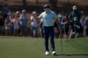 Rory McIlroy of Northern Ireland reacts after a birdie on the 1st hole during the final round of World Tour Golf Championship in Dubai, United Arab Emirates, Sunday, Nov. 16, 2025. (AP Photo/Altaf Qadri)