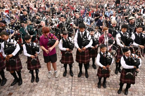 Bagpipers gather to break a world record for the largest ever bagpipe ensemble playing 