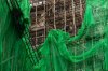 Construction workers remove scaffolding nets from a renovation project in Quarry Bay district after the deadly fire at Wang Fuk Court, in the Tai Po district of Hong Kong's New Territories, Thursday, Dec 4, 2025. (AP Photo/Chan Long Hei)