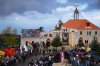People wait outside the Monastery of Saint Maron ahead of Pope Leo XIV's arrival in Annaya, Lebanon, Monday, Dec. 1, 2025. (AP Photo/Hassan Ammar)