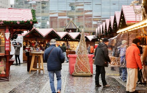 Visitors walk through the Magdeburg Christmas market after the opening in Magdeburg, Germany, Thursday, Nov. 20, 2025. (Matthias Bein/dpa via AP)