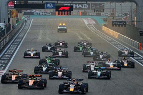 Red Bull driver Max Verstappen of the Netherlands steers his car followed by McLaren driver Lando Norris of Britain during the Formula One Abu Dhabi Grand Prix at the Yas Marina Circuit in Abu Dhabi, UAE, Sunday, Dec. 7, 2025. (AP Photo/Fatima Shbair)